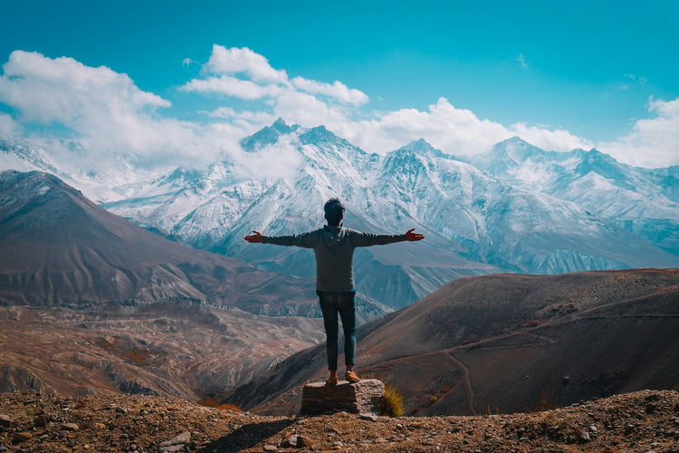 Man With Open Armas From The Top Of The Mountain